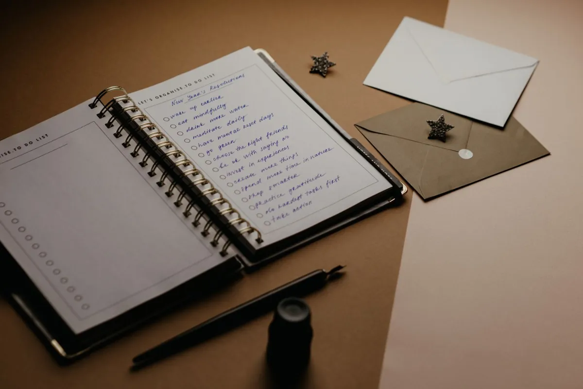 A planner and writing materials on a desk