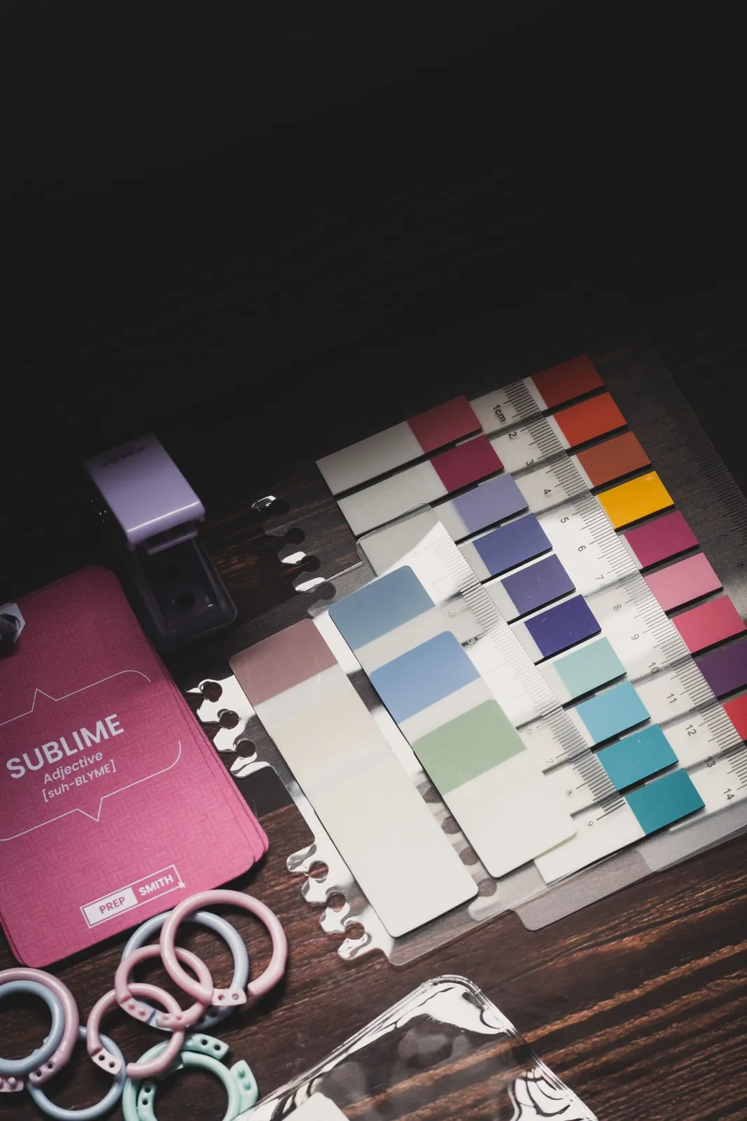 Design materials and color swatches on a dark table